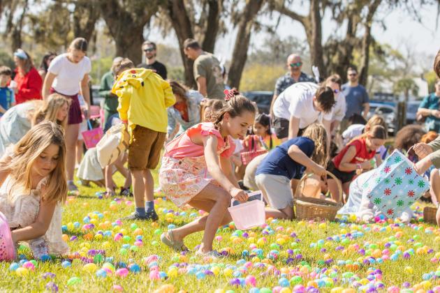 Thousands of colorful plastic eggs were scattered at Central Park on Saturday for local children to gather as part of Fernandina Beach’s second annual Easter Egg Hunt. Photo by Ashley Chandler/News-Leader