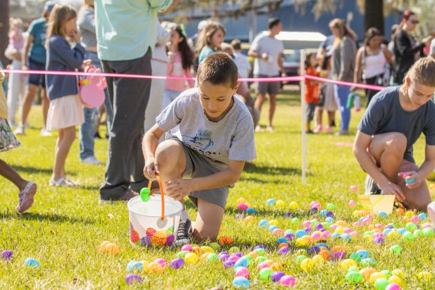 Thousands of colorful plastic eggs were scattered at Central Park on Saturday for local children to gather as part of Fernandina Beach’s second annual Easter Egg Hunt. Photo by Ashley Chandler/News-Leader