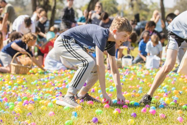 Thousands of colorful plastic eggs were scattered at Central Park on Saturday for local children to gather as part of Fernandina Beach’s second annual Easter Egg Hunt. Photo by Ashley Chandler/News-Leader