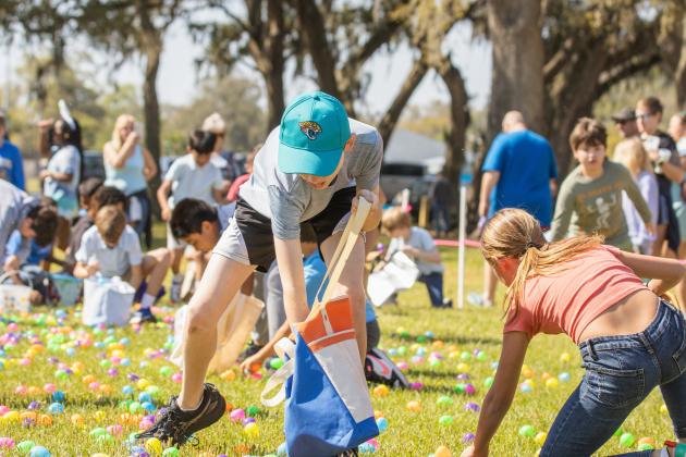 Thousands of colorful plastic eggs were scattered at Central Park on Saturday for local children to gather as part of Fernandina Beach’s second annual Easter Egg Hunt. Photo by Ashley Chandler/News-Leader