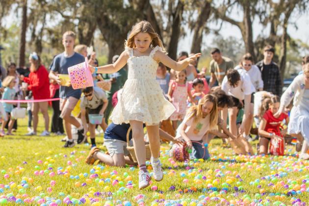 Thousands of colorful plastic eggs were scattered at Central Park on Saturday for local children to gather as part of Fernandina Beach’s second annual Easter Egg Hunt. Photo by Ashley Chandler/News-Leader
