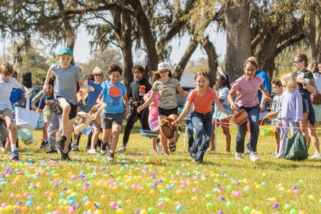 Thousands of colorful plastic eggs were scattered at Central Park on Saturday for local children to gather as part of Fernandina Beach’s second annual Easter Egg Hunt. Photo by Ashley Chandler/News-Leader