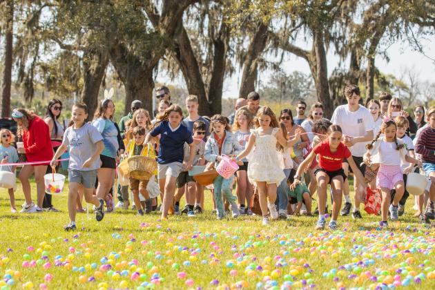 Thousands of colorful plastic eggs were scattered at Central Park on Saturday for local children to gather as part of Fernandina Beach’s second annual Easter Egg Hunt. Photo by Ashley Chandler/News-Leader