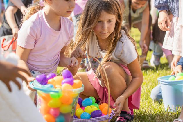 Thousands of colorful plastic eggs were scattered at Central Park on Saturday for local children to gather as part of Fernandina Beach’s second annual Easter Egg Hunt. Photo by Ashley Chandler/News-Leader