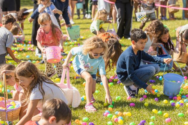 Thousands of colorful plastic eggs were scattered at Central Park on Saturday for local children to gather as part of Fernandina Beach’s second annual Easter Egg Hunt. Photo by Ashley Chandler/News-Leader