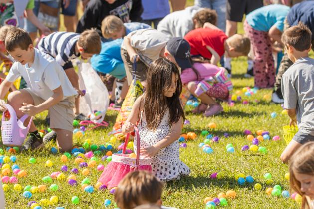 Thousands of colorful plastic eggs were scattered at Central Park on Saturday for local children to gather as part of Fernandina Beach’s second annual Easter Egg Hunt. Photo by Ashley Chandler/News-Leader
