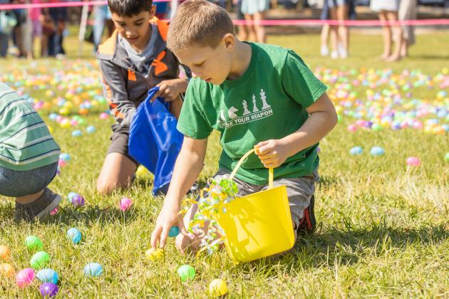 Thousands of colorful plastic eggs were scattered at Central Park on Saturday for local children to gather as part of Fernandina Beach’s second annual Easter Egg Hunt. Photo by Ashley Chandler/News-Leader