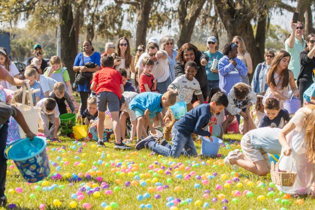 Thousands of colorful plastic eggs were scattered at Central Park on Saturday for local children to gather as part of Fernandina Beach’s second annual Easter Egg Hunt. Photo by Ashley Chandler/News-Leader