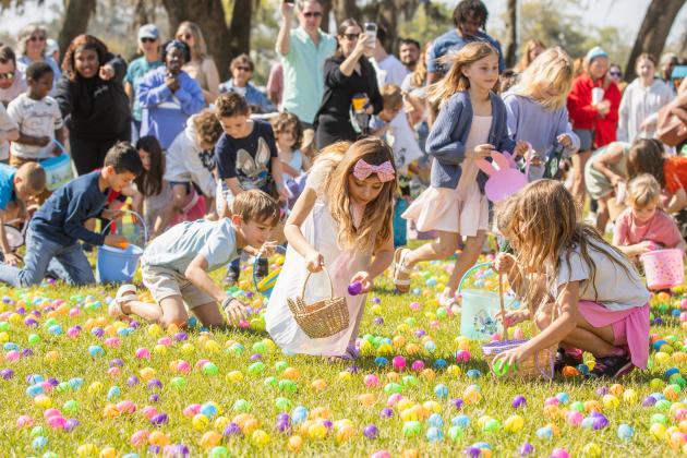 Thousands of colorful plastic eggs were scattered at Central Park on Saturday for local children to gather as part of Fernandina Beach’s second annual Easter Egg Hunt. Photo by Ashley Chandler/News-Leader