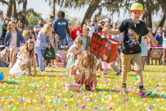 Thousands of colorful plastic eggs were scattered at Central Park on Saturday for local children to gather as part of Fernandina Beach’s second annual Easter Egg Hunt. Photo by Ashley Chandler/News-Leader