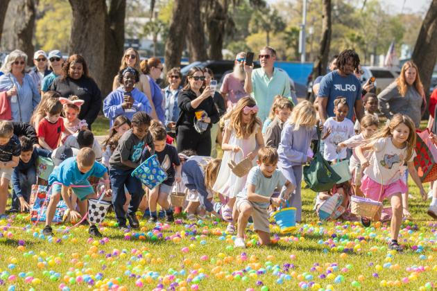 Thousands of colorful plastic eggs were scattered at Central Park on Saturday for local children to gather as part of Fernandina Beach’s second annual Easter Egg Hunt. Photo by Ashley Chandler/News-Leader