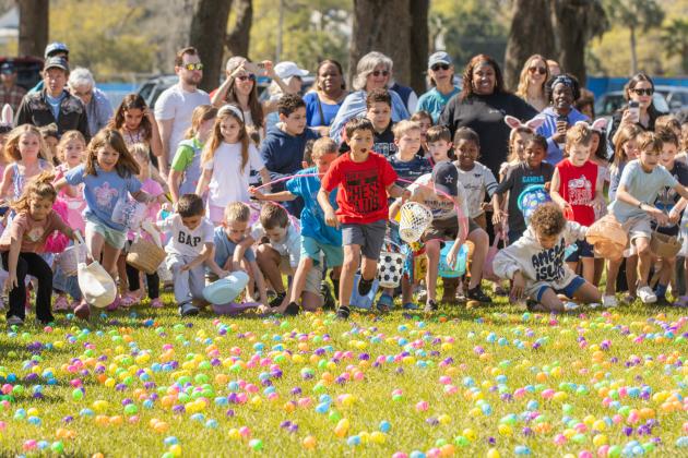 Thousands of colorful plastic eggs were scattered at Central Park on Saturday for local children to gather as part of Fernandina Beach’s second annual Easter Egg Hunt. Photo by Ashley Chandler/News-Leader