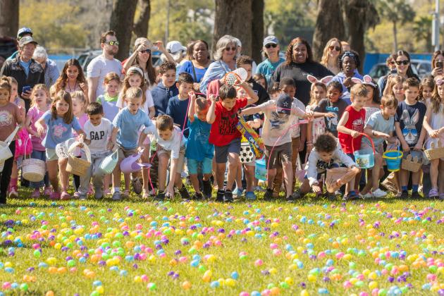 Thousands of colorful plastic eggs were scattered at Central Park on Saturday for local children to gather as part of Fernandina Beach’s second annual Easter Egg Hunt. Photo by Ashley Chandler/News-Leader
