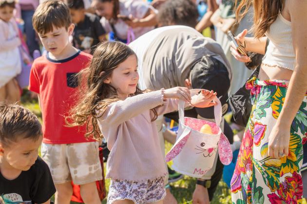 Thousands of colorful plastic eggs were scattered at Central Park on Saturday for local children to gather as part of Fernandina Beach’s second annual Easter Egg Hunt. Photo by Ashley Chandler/News-Leader