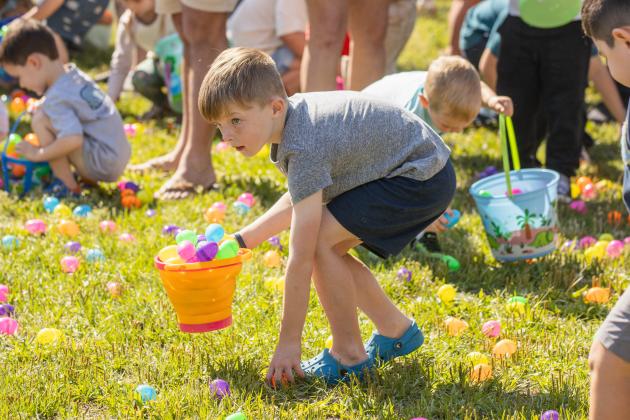 Thousands of colorful plastic eggs were scattered at Central Park on Saturday for local children to gather as part of Fernandina Beach’s second annual Easter Egg Hunt. Photo by Ashley Chandler/News-Leader