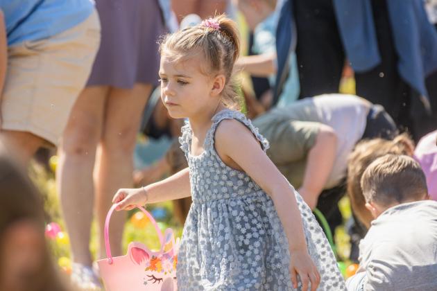Thousands of colorful plastic eggs were scattered at Central Park on Saturday for local children to gather as part of Fernandina Beach’s second annual Easter Egg Hunt. Photo by Ashley Chandler/News-Leader