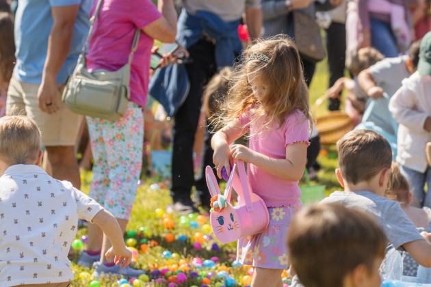 Thousands of colorful plastic eggs were scattered at Central Park on Saturday for local children to gather as part of Fernandina Beach’s second annual Easter Egg Hunt. Photo by Ashley Chandler/News-Leader