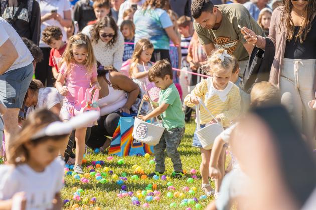Thousands of colorful plastic eggs were scattered at Central Park on Saturday for local children to gather as part of Fernandina Beach’s second annual Easter Egg Hunt. Photo by Ashley Chandler/News-Leader