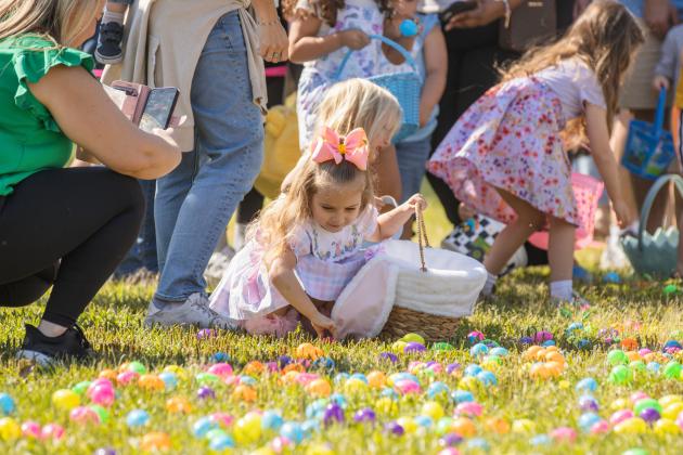 Thousands of colorful plastic eggs were scattered at Central Park on Saturday for local children to gather as part of Fernandina Beach’s second annual Easter Egg Hunt. Photo by Ashley Chandler/News-Leader