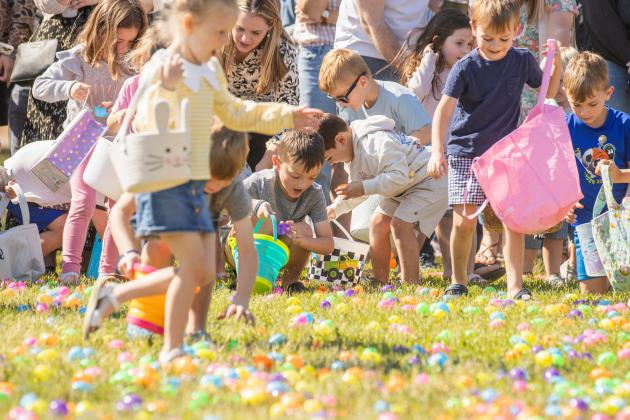 Thousands of colorful plastic eggs were scattered at Central Park on Saturday for local children to gather as part of Fernandina Beach’s second annual Easter Egg Hunt. Photo by Ashley Chandler/News-Leader