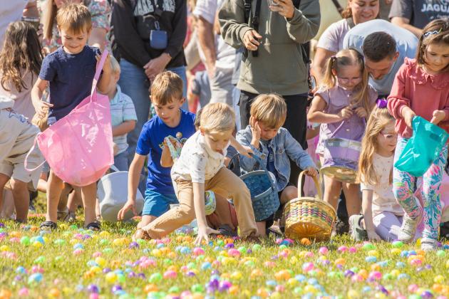 Thousands of colorful plastic eggs were scattered at Central Park on Saturday for local children to gather as part of Fernandina Beach’s second annual Easter Egg Hunt. Photo by Ashley Chandler/News-Leader