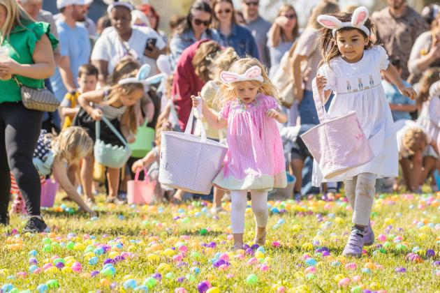 Thousands of colorful plastic eggs were scattered at Central Park on Saturday for local children to gather as part of Fernandina Beach’s second annual Easter Egg Hunt. Photo by Ashley Chandler/News-Leader