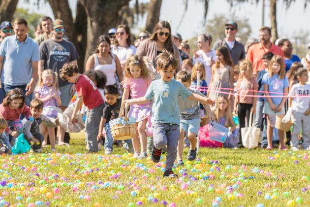 Thousands of colorful plastic eggs were scattered at Central Park on Saturday for local children to gather as part of Fernandina Beach’s second annual Easter Egg Hunt. Photo by Ashley Chandler/News-Leader