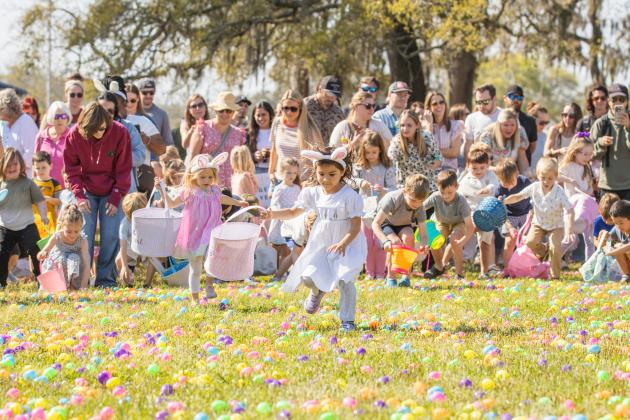 Thousands of colorful plastic eggs were scattered at Central Park on Saturday for local children to gather as part of Fernandina Beach’s second annual Easter Egg Hunt. Photo by Ashley Chandler/News-Leader