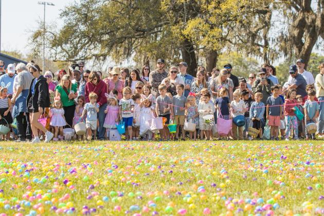 Thousands of colorful plastic eggs were scattered at Central Park on Saturday for local children to gather as part of Fernandina Beach’s second annual Easter Egg Hunt. Photo by Ashley Chandler/News-Leader