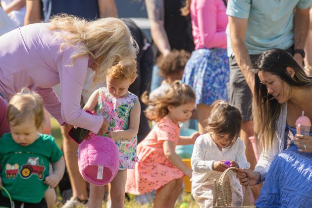 Thousands of colorful plastic eggs were scattered at Central Park on Saturday for local children to gather as part of Fernandina Beach’s second annual Easter Egg Hunt. Photo by Ashley Chandler/News-Leader