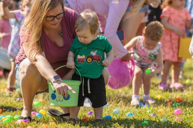 Thousands of colorful plastic eggs were scattered at Central Park on Saturday for local children to gather as part of Fernandina Beach’s second annual Easter Egg Hunt. Photo by Ashley Chandler/News-Leader