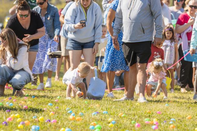 Thousands of colorful plastic eggs were scattered at Central Park on Saturday for local children to gather as part of Fernandina Beach’s second annual Easter Egg Hunt. Photo by Ashley Chandler/News-Leader