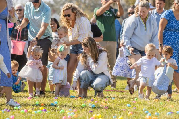 Thousands of colorful plastic eggs were scattered at Central Park on Saturday for local children to gather as part of Fernandina Beach’s second annual Easter Egg Hunt. Photo by Ashley Chandler/News-Leader