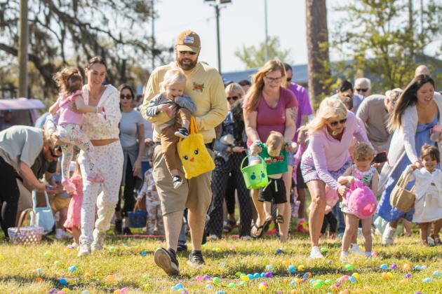 Thousands of colorful plastic eggs were scattered at Central Park on Saturday for local children to gather as part of Fernandina Beach’s second annual Easter Egg Hunt. Photo by Ashley Chandler/News-Leader