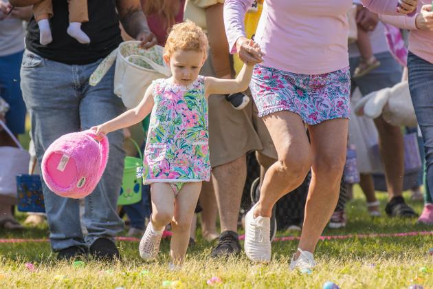 Thousands of colorful plastic eggs were scattered at Central Park on Saturday for local children to gather as part of Fernandina Beach’s second annual Easter Egg Hunt. Photo by Ashley Chandler/News-Leader