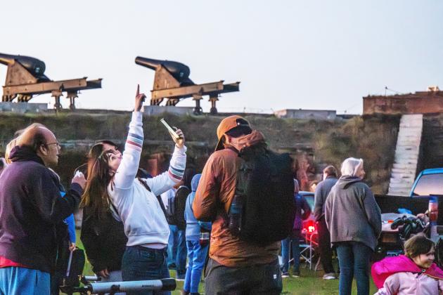 Rob Krahl, left, and his family brought their telescope and astronomy app to the Astronomy Night at Fort Clinch State Park. Photo by Ashley Chandler/News-Leader