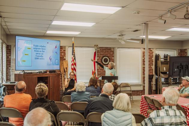 Theresa Hartz, member of the Amelia Island Whale Ambassadors, speaks during the Brown Bag Lunch held Wednesday at the Amelia Island Museum of History. Photo by Ashley Chandler/News-Leader