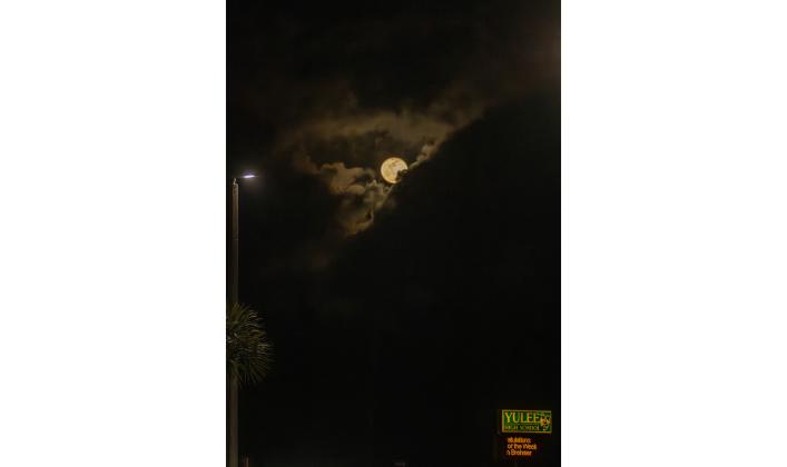 The moon rises over the Yulee High School on Wednesday. Photo by Ashley Chandler/News-Leader