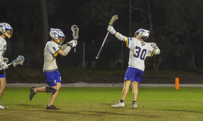 Pirate Senior Ben Adams, right, celebrates one of his six goals on Friday night against Sandalwood. Photo by Ashley Chandler/News-Leader