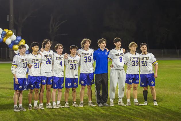 Seniors on the Fernandina Beach High School boys lacrosse team during halftime of Friday’s game at FBHS. Photo by Ashley Chandler/News-Leader