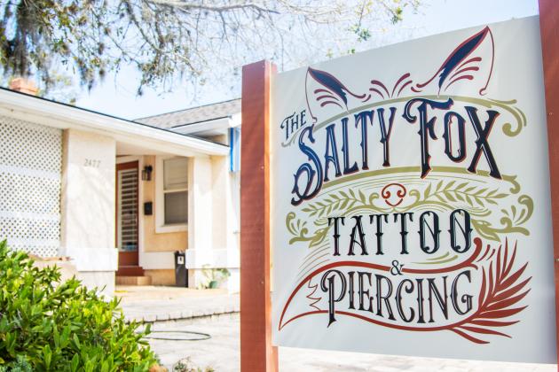 The new logo on the sign outside The Salty Fox Tattoo and Piercing. Photo by Ashley Chandler/News-Leader