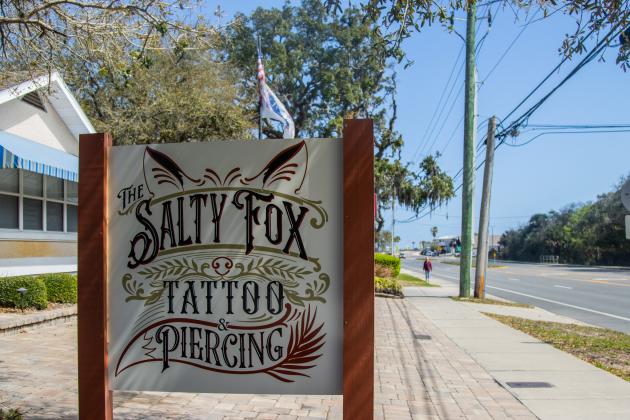 The new logo on the sign outside The Salty Fox Tattoo and Piercing. Photo by Ashley Chandler/News-Leader