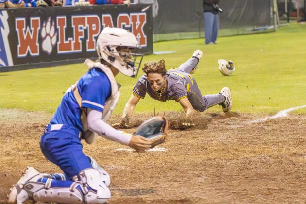 Yulee High’s Eli Lucio slides into home for a run against Wolfson on Feb. 17. Photo by Nick Blank/News-Leader