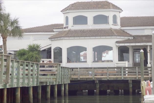 A view of the former Brett’s Waterway Cafe across the pier Thursday. Marisa DeMar/News-Leader