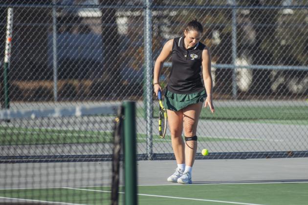 Magdalena (Magda) Urbanowicz prepares to serve in a February match at Yulee High School. Photo by Ashley Chandler/News-Leader