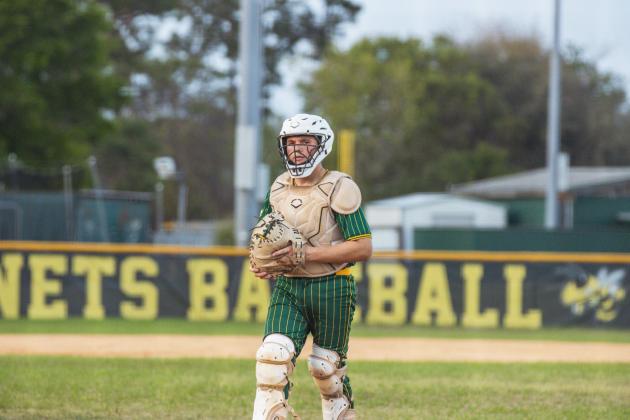 YHS Catcher Evan Deal prepares for another inning in a game March 31 against Camden County.  Photo by Ashley Chandler/News-Leader