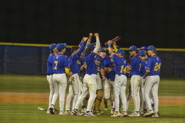 The Pirates celebrate earning the district title last week. Photo by Ashley Chandler/News-Leader