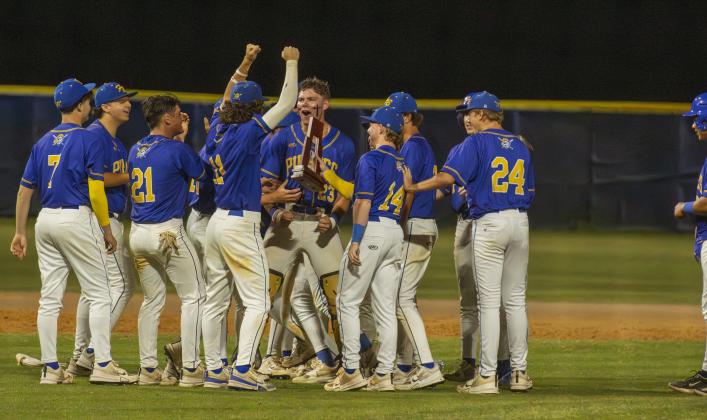 The Pirates celebrate earning the district title last week. Photo by Ashley Chandler/News-Leader