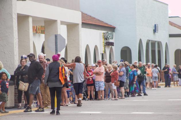 A line of people formed outside ALDI on Thursday for a ribbon cutting event to celebrate the opening of the new ALDI, formerly Winn-Dixie. Photo by Marisa DeMar/News-Leader