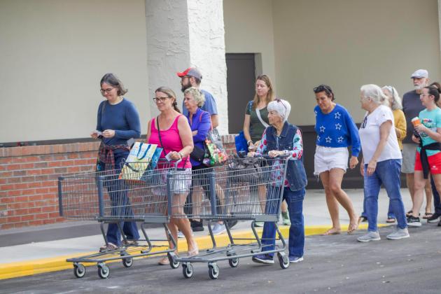 A line of people formed outside ALDI on Thursday for a ribbon cutting event to celebrate the opening of the new ALDI, formerly Winn-Dixie. Photo by Marisa DeMar/News-Leader